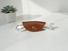 Copper leather cord taco snapped around earbuds, personalized cord organizer with gold snap