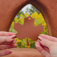 Video of the leather maple leaf bag charm